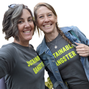 Andy and bestie / Shambala Resident Carol Lacey in tshirts that say "Sustainable Gangster"