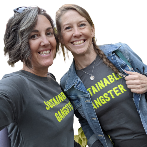Andy and bestie / Shambala Resident Carol Lacey in tshirts that say "Sustainable Gangster"