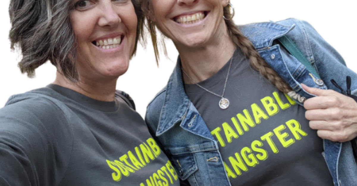 Andy and bestie / Shambala Resident Carol Lacey in tshirts that say "Sustainable Gangster"
